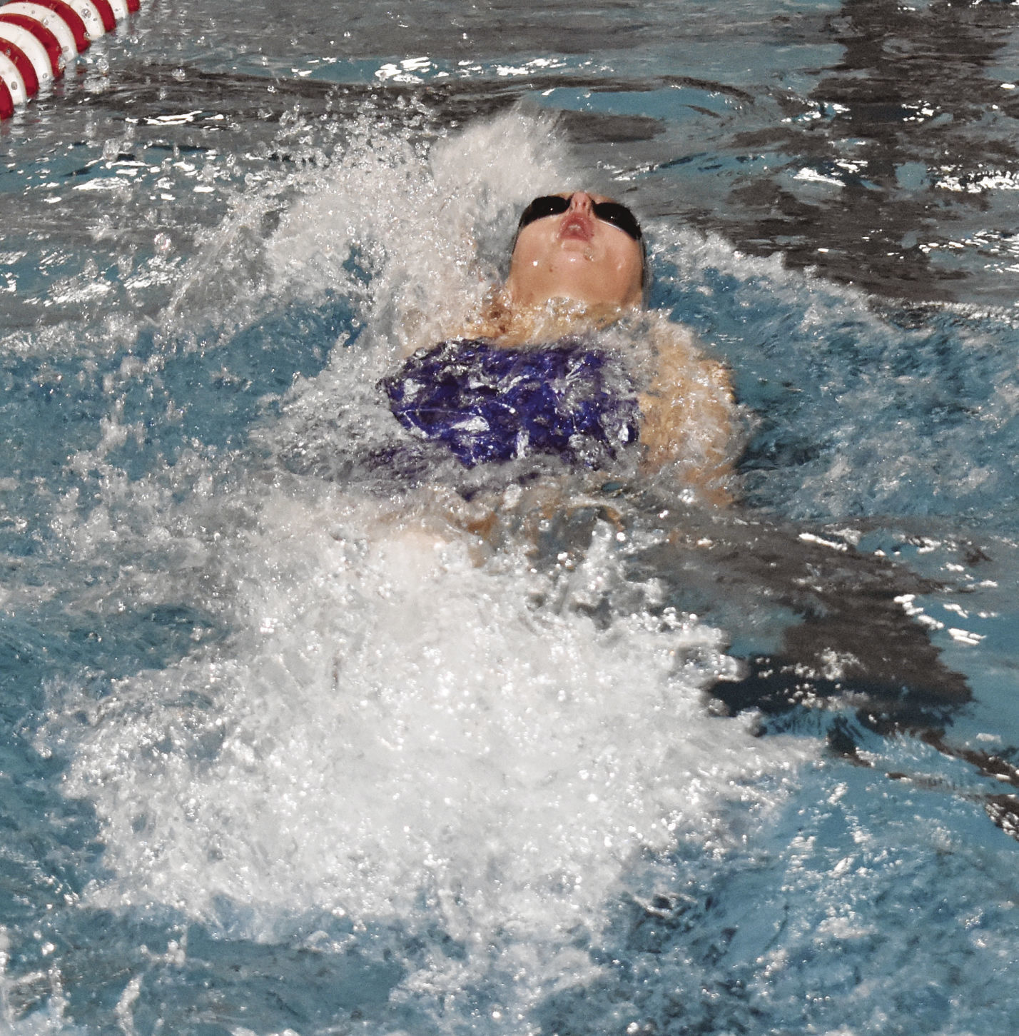 Prep girls swimming photo: McFarland's Mara Freeman swims in the backstroke relay